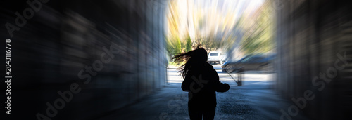 Canvas Print A girl fleeing from a chase, running quickly with urgency and fear, highlighting tension, danger, and dramatic movement