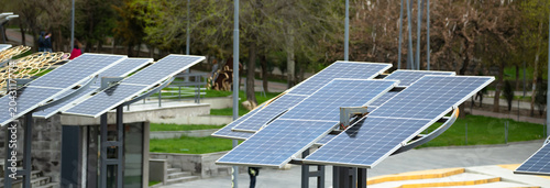 Schilderij op canvas Solar power system with photovoltaic panels converting sunlight into renewable e