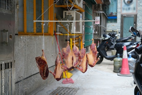 Bilde på lerret Air drying cured duck meat in a street of Macau
