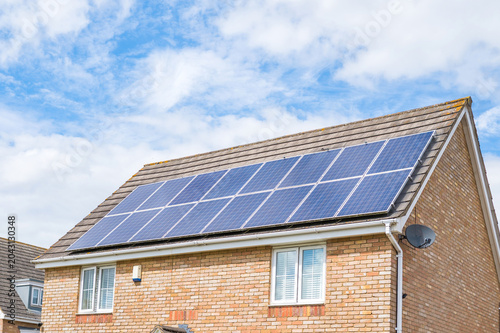 Fotografía Photovoltaic panels mounted on the roof of a modern home as part of a renewable