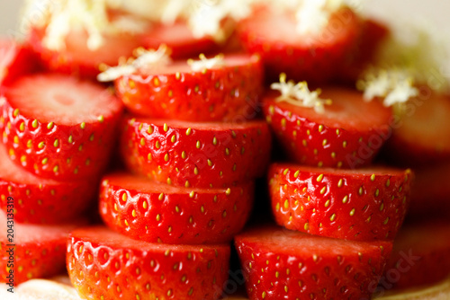 Cake topped with fresh strawberries.