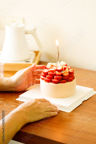 Cake topped with fresh strawberries.