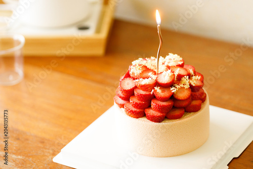 Cake topped with fresh strawberries.
