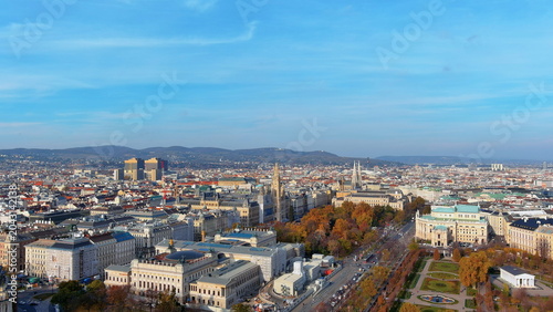 4K aerial drone image of Vienna, Austria. Beautiful autumn cityscape panorama featuring the Burgtheater, Rathaus, and Ringstrasse boulevard.