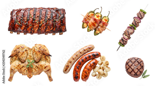 Assortment of delicious grilled meats, including ribs, chicken, sausages, steak, and skewers, transparent background.