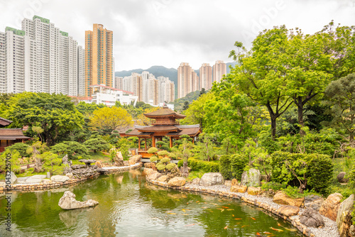 Photography Ancient Wooden Pavilion on a Pond and Hong Kongs Skyscrapers