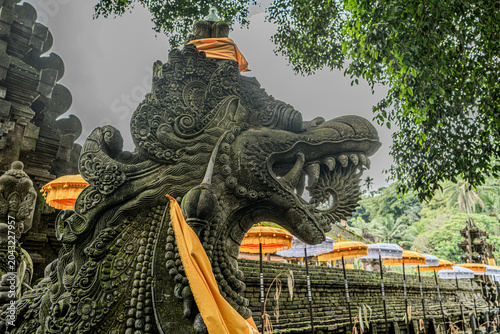 Indonesian statue in a temple with offerings