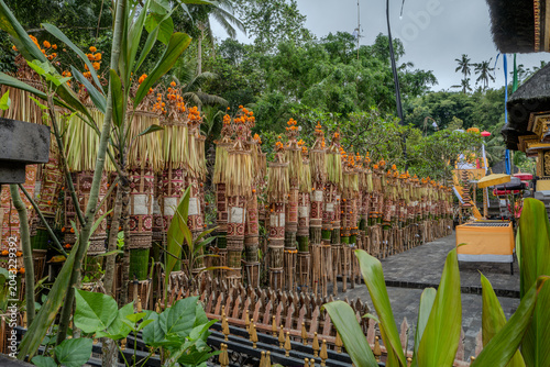 Indonesian statue in a temple with offerings