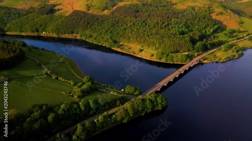 Aerial drone view of A57 viaduct bridge crossing Ladybower Reservoir in Peak District