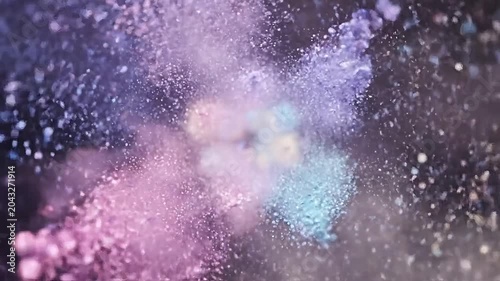 Vibrant pastel powder explosion against a dark background, creating a sense of dynamic energy and creativity.