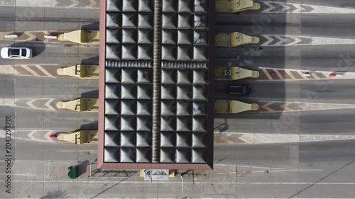 Aerial View of Cars Passing Through Toll Booths on a Highway