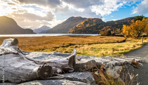 Autumnal Landscape with Mountains and Lake at Sunset.