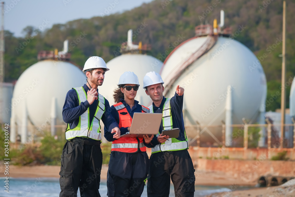 Fototapeta premium Safety meeting among engineers at industrial facility team collaboration outdoor environment professional viewpoint