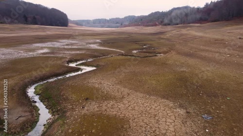 Dry Lake Bed in Mavrovo National Park: A River Winds Through Cracked Earth