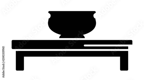 Simple Black Silhouette of a Bowl on a Table.