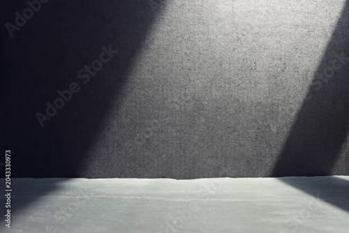 image of a black table and dark textured background.