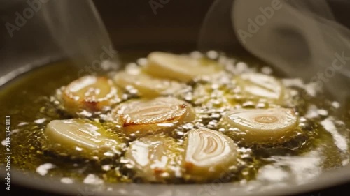 Garlic Slices Frying in Hot Oil