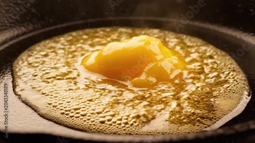 Golden Ghee Melting in Hot Cast Iron Skillet