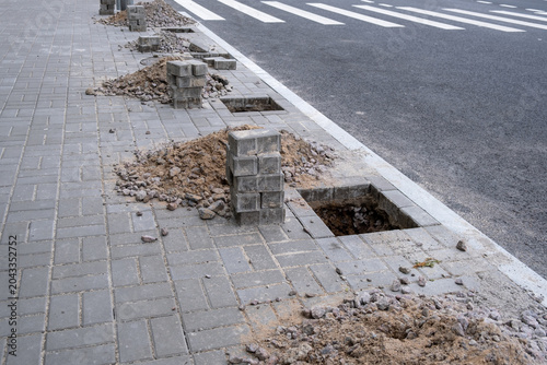Sidewalk repair and reconstruction with holes in pavement