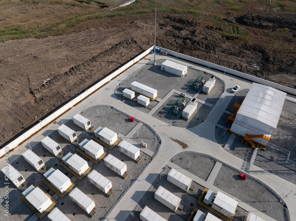 Naklejka premium aerial view of energy storage power station with container battery equipment and industrial facilities