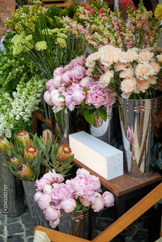 Stalls with flowers and bouquets at local street market