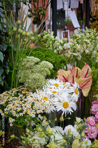 Stalls with flowers and bouquets at local street market
