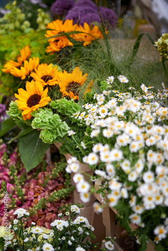 Stalls with flowers and bouquets at local street market