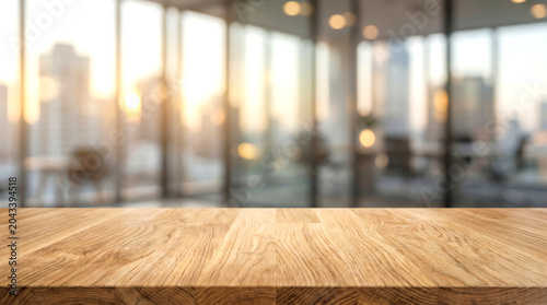 Empty wood desk surface in blurred corporate office background with sunset city view for product advertising mockup