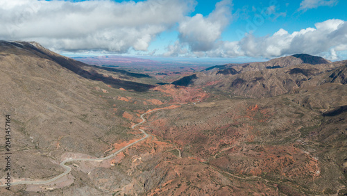 Aerial drone view of the winding road through Cuesta de Miranda canyon on Ruta 40, La Rioja, Argentina.