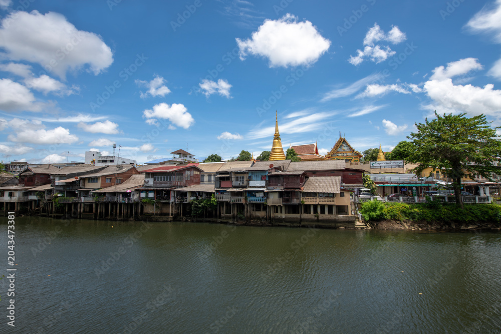 Fototapeta premium The old waterfront community. Chanthaburi Old Town Waterfront, Landmark with old building village in Chanthaburi Thailand.