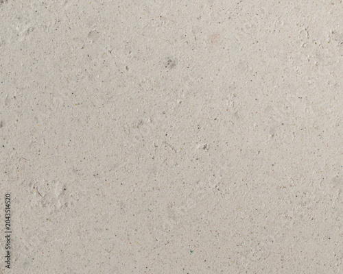 Foto Off white pigment texture full frame macro real organic surface with fine grain colorful specks and subtle scratches minimal backdrop for design