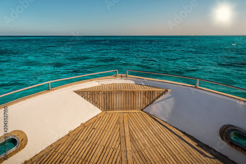 View on yacht nose and blue open sea
