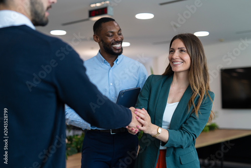 Professionals shaking hands agreeing on new business collaboration
