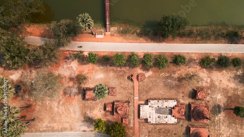 Canvas Print Sukhothai historical park aerial view with ancient ruins, road, and lake