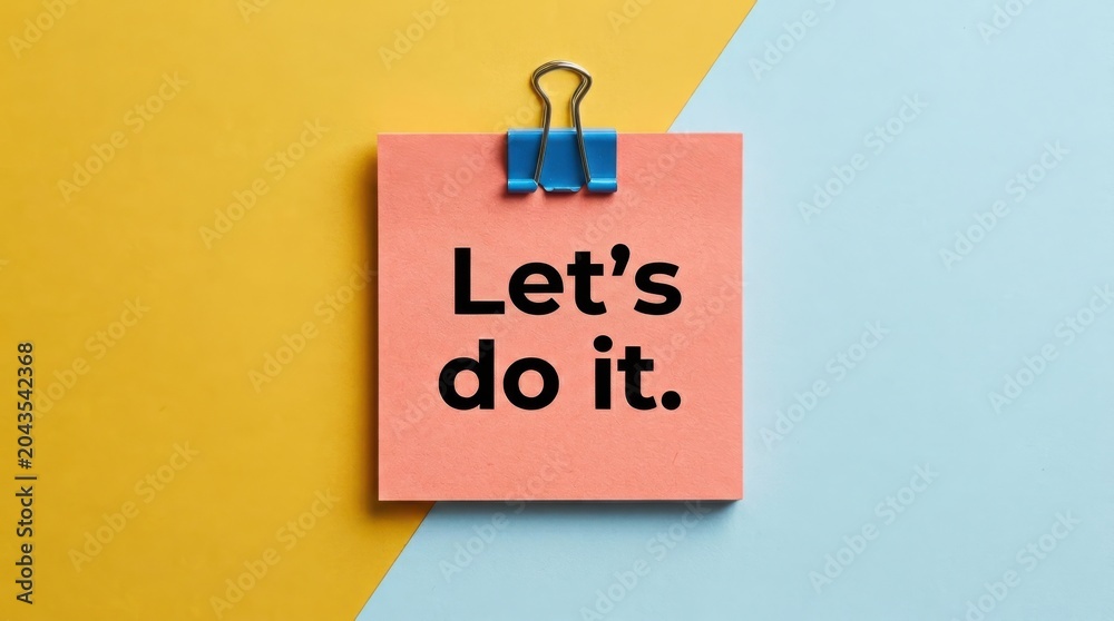 © Drago Designer - Motivational sticky note with Let's do it text, pink adhesive memo on yellow and blue background, inspirational message for business productivity