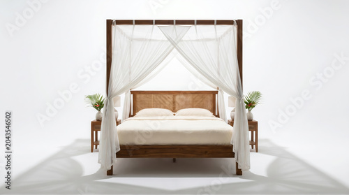 Luxury four-poster bed with white canopy and wooden frame in modern bedroom setting with tropical vibes and high quality