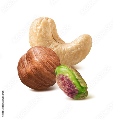 Cashew, hazelnut and pistachio nut isolated on white background. Real nuts photography