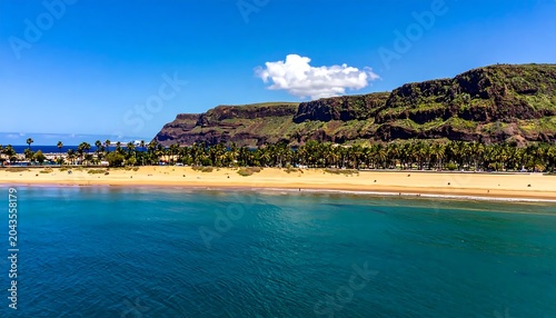 Sunny Tropical Beach and Rocky Cliffs Along Calm Blue Ocean Coastline