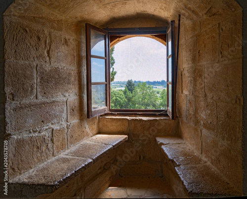 Niche with stone benches and window holes in the residential tower of Kolossi Castle near the city of Limassol on Cyprus