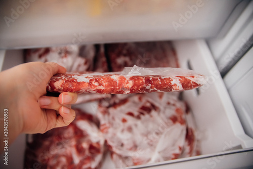 Valokuva Various frozen beef cuts packed in bags inside the freezer