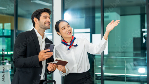Canvastavla Friendly airline service agent helping corporate male passenger with digital boa