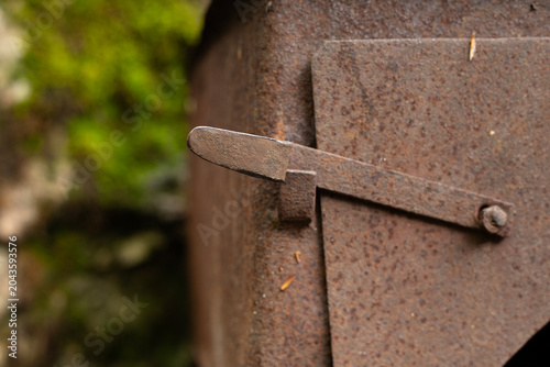 Old rusty metal stove in nature