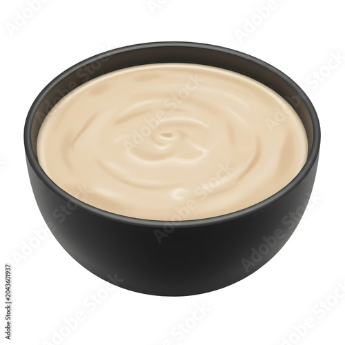 Creamy dish in a stylish black bowl isolated on white background