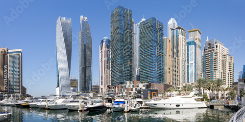 Quadro su tela Dubai Marina skyline cityscape with yachts skyscraper buildings living at water