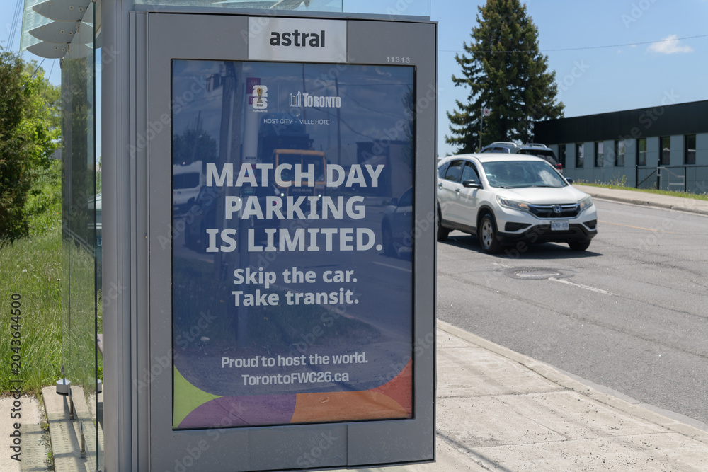 Obraz premium Astral Media out-of-home bus shelter advertising poster for host city FIFA World Cup re: match day parking, Birchmount Rd, Scarborough, Toronto