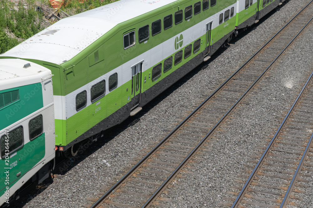 Obraz premium bird's eye view of Go Train running westbound at Metrolinx Lakeshore East Rail Corridor (Kingston Subdivision), Scarborough, Toronto