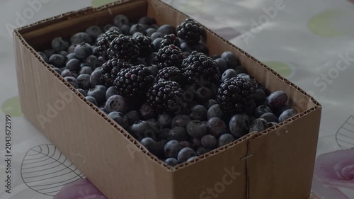 Blueberries and blackberries in cardboard tray. Original sound. Prores 422HQ