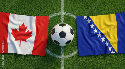 Soccer ball placed between Canadian and Bosnian national country flags