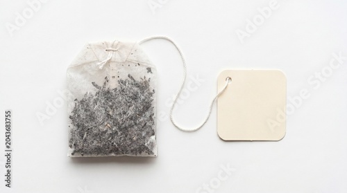 Single lavender herbal tea bag with a blank paper tag