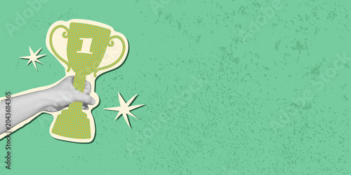 Fotografia Human hand holding a champion trophy in retro collage style on green background